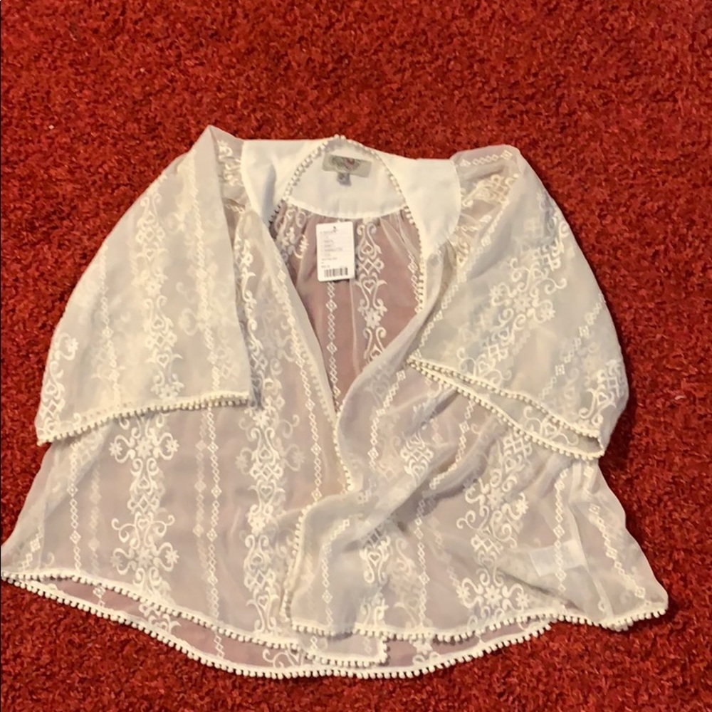 a white transparent cardigan